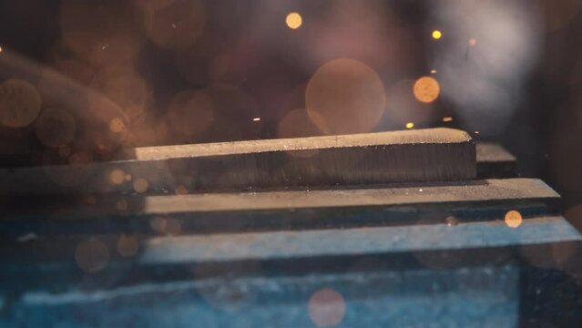 Experience the fiery spectacle as an angle grinder ignites showers of sparks in mesmerizing 4K slow motion.