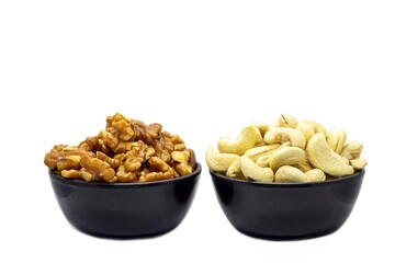 Walnut and Cashew Nut Dried Fruits in Black Bowls Isolated on White Background in Horizontal Orientation, Healthy Eating and Lifestyle Food Concepts