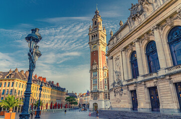 Lille Chamber of Commerce Nouvelle Bourse with belfry bell tower, Opera de Lille theatre and street light on Place du Theatre square in Lille city historical center, Nord department, Northern France