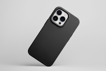 smartphone in black soft silicone case falls down back view, phone case mockup isolated on grey...