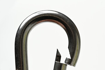 silver colored carabiner close-up on white background