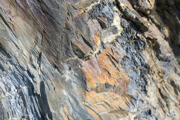 Stone pattern, granite rock surface, colored rock detail texture, rock structures, marble granite deposit.