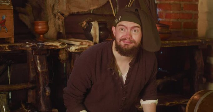 Sly seller hides rare dry roots meeting guest in store. Scared bartender studies magic potion ingredients while adventurer comes in tavern. Fantasy game