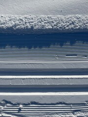 Prepared classic cross-country ski track on snow. Winter sports background - 741746237