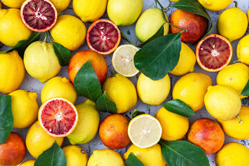 Fresh citruses. Oranges, lemons and leaves  . Top view