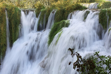 Fototapeta premium Picturesque view of beautiful waterfall and rocks outdoors