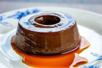 chocolate pudding or also known as flan, over wooden table