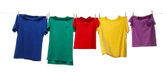 Colorful t-shirts drying on washing line isolated on white © New Africa