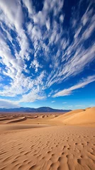 Poster A vast expanse of sand dunes under a blue sky with clouds © Adobe Contributor
