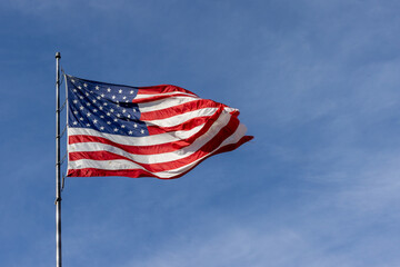 stretched out American flag flying in the wind