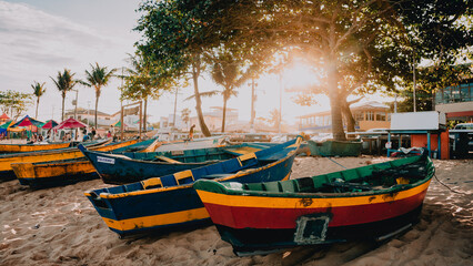 A beautiful photograph of fishermen's boats on the shores of the Atlantic Ocean in Vitória, Brazil.