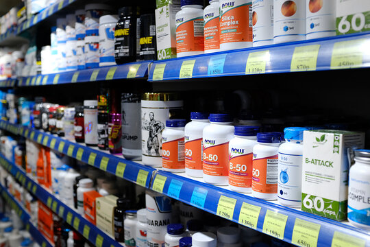 dietary supplements pills on the shelves in the store. selling dietary supplements pills offline