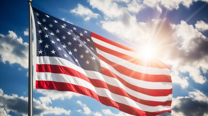 American flag waving in the wind with a bright sun behind it
