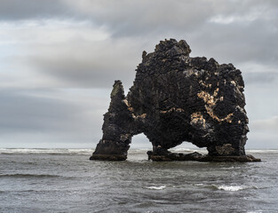 The drinking elephant or rhinoceros, basalt stack Hvitserkur along the eastern shore of Vatnsnes...