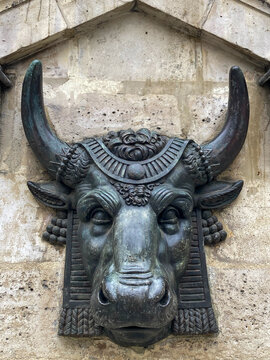 Paris, France, Europe. Carved mystical bull