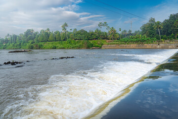 A beautiful view of a waterfall from a check dam In Kerala, India.