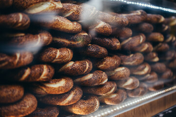 Freshly baked traditional turkish simit bagel on sale in a local bakery in Istanbul, Turkey. - 741850834