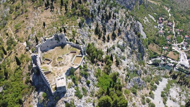 Fortress on a cliff, aerial drone view. Old castle on the hill, view from above. The Herceg Stjepan castle in Blagaj, Bosnia and Herzegovina. 