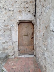 Fototapeta premium castle door. carved stone secondary entrance in a medieval castel, France 