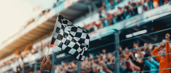 Victory's flag waves against a backdrop of speed and excitement at the finish line