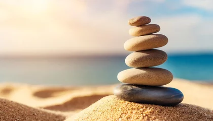 Foto auf Acrylglas Steine​ im Sand stacked zen stones sand background art of balance concept banner
