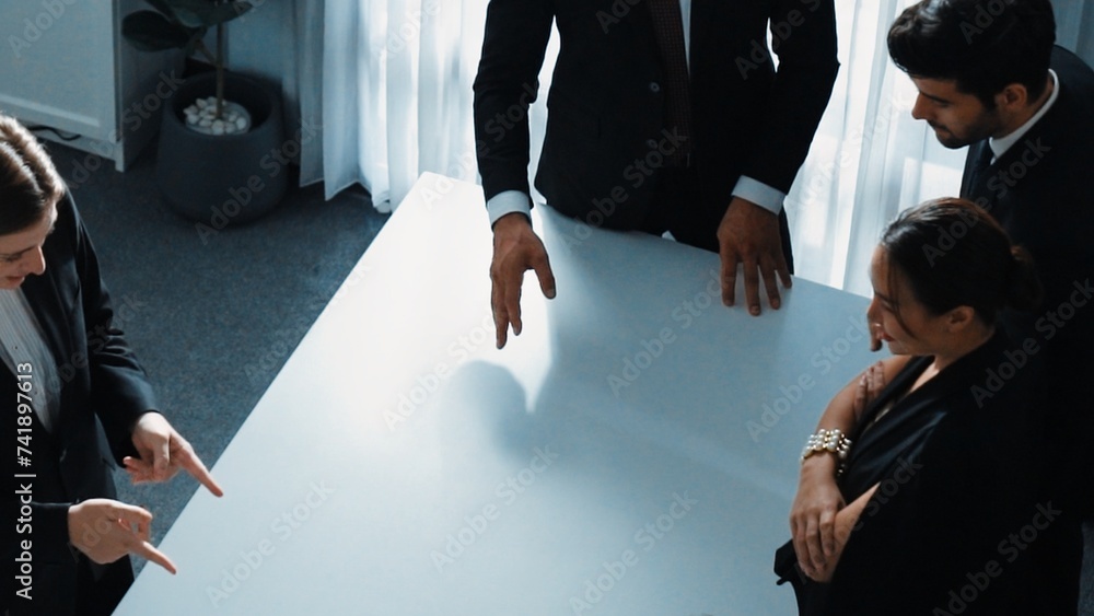 Poster top view of project manager looking at meeting table surrounded by diverse business people brainstor