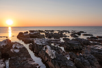 Rocks on sea in sunset - 741904875