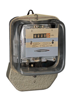 Old type energy meter for measuring electricity consumed in households. Isolated background.