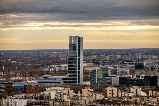 Fototapeta Mol Campus Budapest, modern office building rising above houses and high rises in hungarian capital city