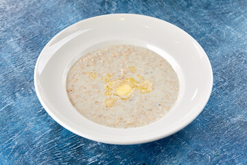 oatmeatl porridge in white plate