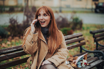 Amazed stylish woman in retro clothes is having a phone call on street