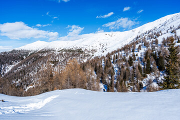 Winter landscape with snow covered Dolomites in Kronplatz, Italy