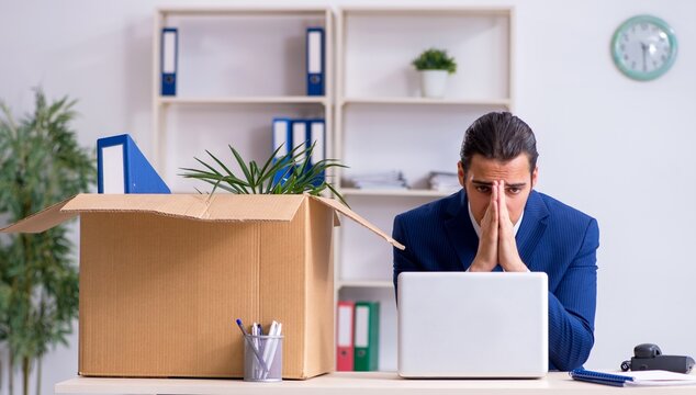 Young employee being made redundant