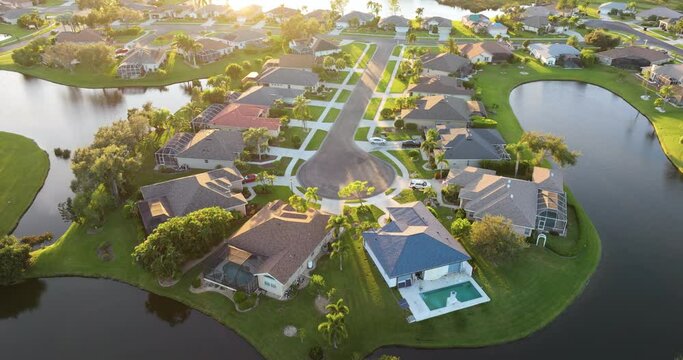 Aerial view of private homes in Florida residential area at sunset. New family houses as example of real estate development in American suburbs