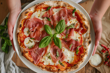 Freshly Baked Prosciutto and Mozzarella Pizza Garnished with Basil