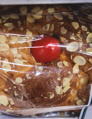 Tsoureki, Traditional Greek Easter Bread, greek freshly baked cake in Athens, Greece, with almond, mastiha, mahleb and cinnamon, orthodox Easter in Greece, sweet bread with red eggs