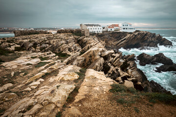 rocky coast of the Atlantic ocean at Baleal peninsula, Ferrel, municipality of Peniche, district of Leiria, Portugal - 741973484