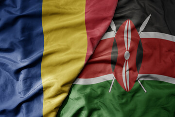 big waving national colorful flag of kenya and national flag of romania .