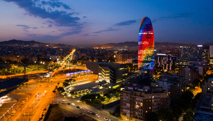 Aerial cityscape of Barcelona with modern Torre Glories skyscraper