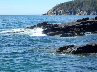 Ocean waves meeting a rocky shore