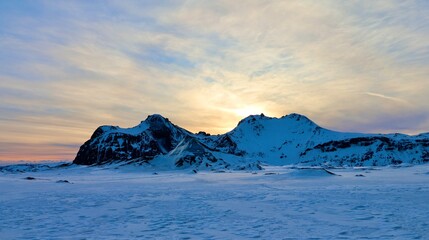 Sunset Over Snowy Mountains of Southern Iceland