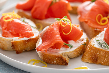 Smoked salmon crostini with cream cheese, dill and lemon zest