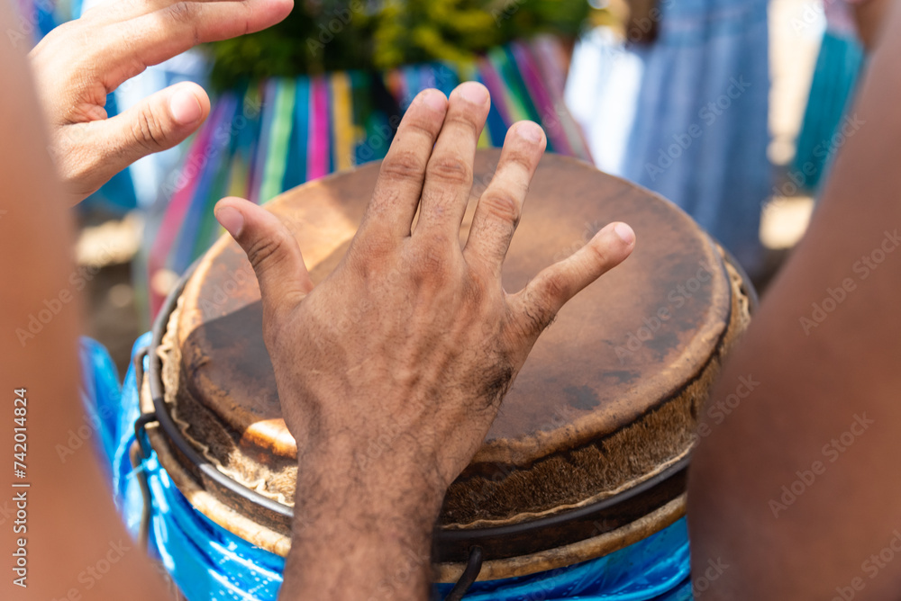 Sticker percussionist hands playing atabaque.