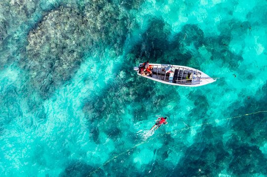Aerial view, fishermen catching fish on the reefs at Cap Malheureux, Grand Gaube, Pamplemousses region, Mauritius, Africa