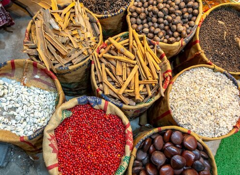 A bird's-eye view of sacks with various colorful spices and herbs for sale at a market in Fort Kochi, Cochin, Kerala, India, Asia