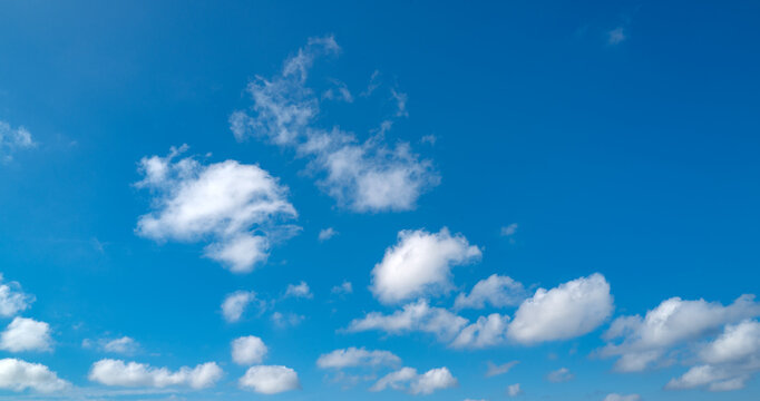 Blue Heaven and white clouds. Sky (clouds) background. White cloudy on Heaven with soft sun light. Clouds on pastel blue sky background. Sky Landscape Background. Sky Clouds Wallpaper.