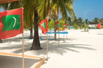 Flags of the Maldive Republic in a street in Mathiveri island, Ari North Atoll