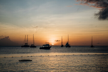 Tropical Pastel Island Sunset with Boats over the ocean in Saint Lucia in the Caribbean