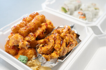 Torched shrimp sushi roll with spicy mayo and teriyaki sauce