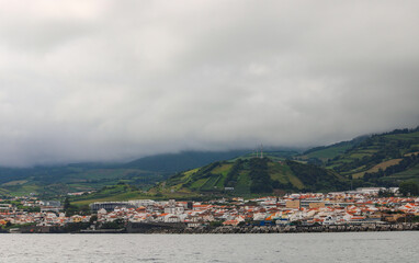 view of a foggy city from the sea